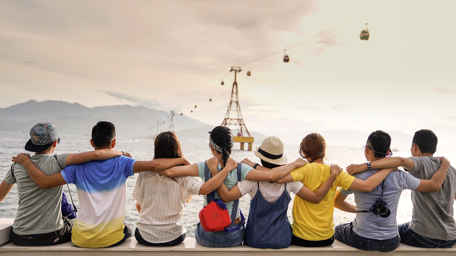 Friends supporting each other outdoors